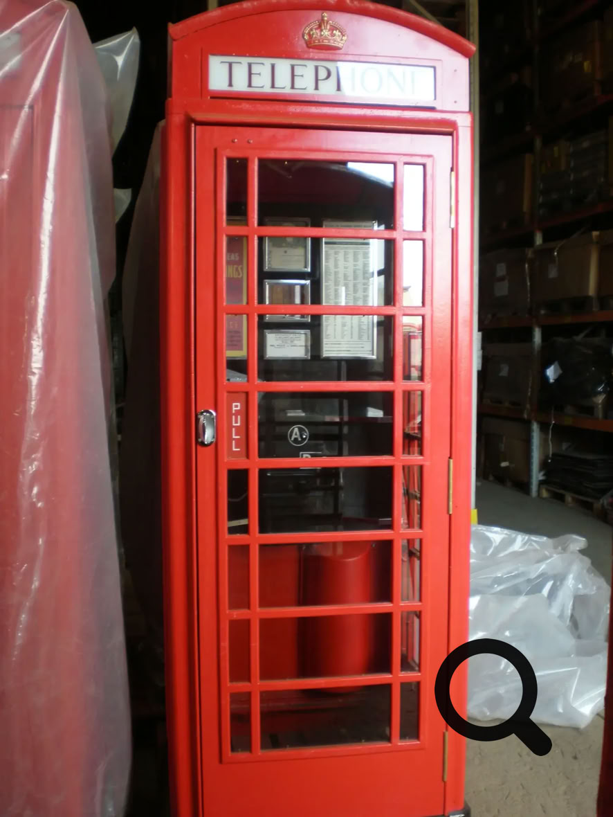 A telephone box made of fibre optics serves as a door way.